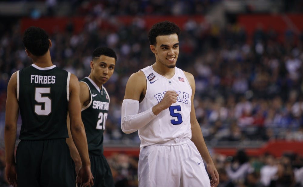 Tyus Jones was smiling Saturday just as he was Dec. 3 after leading Duke past then-No. 2 Wisconsin. The Blue Devils and Badgers will battle again in the national title game Monday.