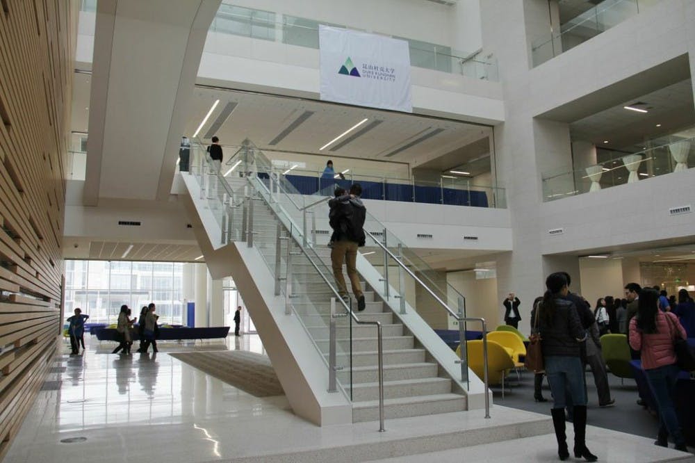Alumni walk to the second floor of the academic center, which is three stories.