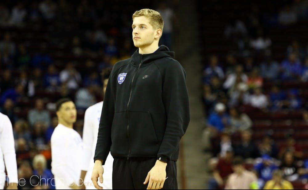 Jack White was in sweats Friday night after suffering a hamstring injury during the Blue Devils' ACC tournament finale.