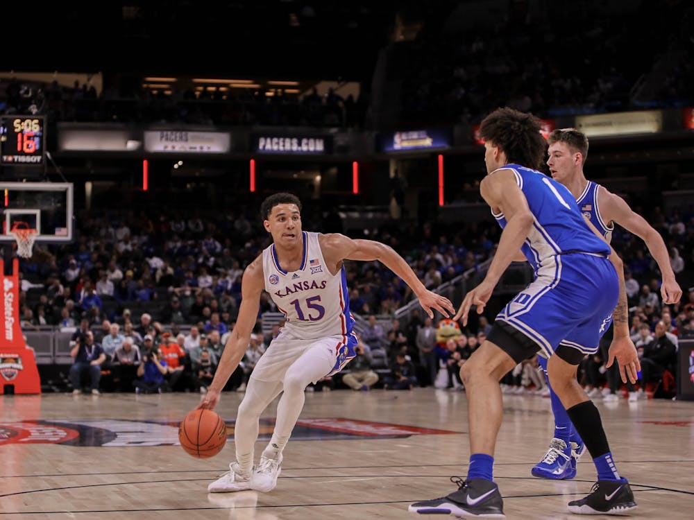 <p>Kansas' Kevin McCullar Jr. drives to the rim in the first half Duke's matchup with the Jayhawks in the Champions Classic. McCullar had eight points and two blocks at the half.</p>