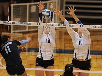 Kellie Catanach, left, became the third player in program history to reach 5,000 career assists Sunday.