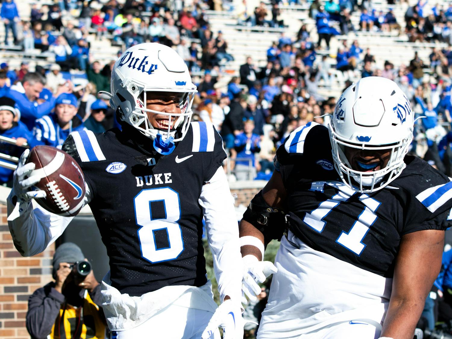 Jordan Moore (8) and Maurice McIntyre celebrate the Blue Devils' first touchdown against Pittsburgh