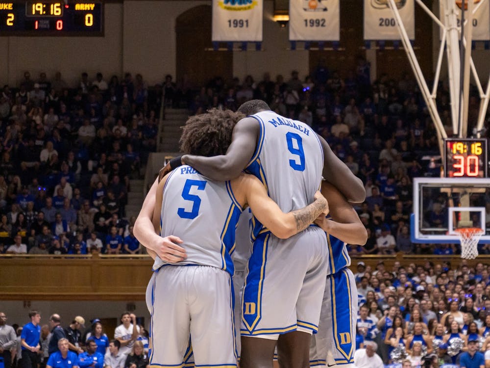 The Blue Devils huddle up during their game against Army.