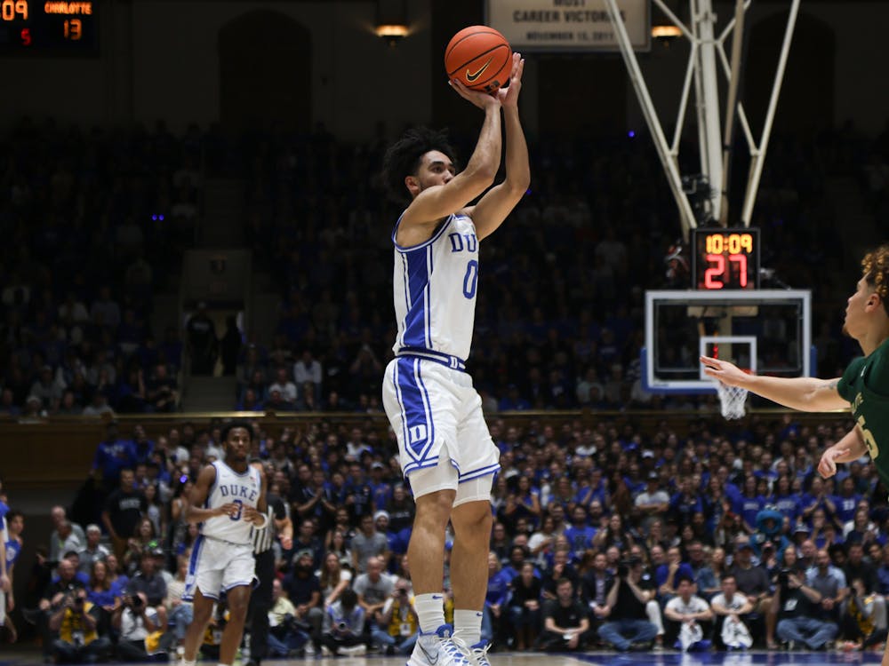 Jared McCain releases a shot during the first half of Duke's game against Charlotte.