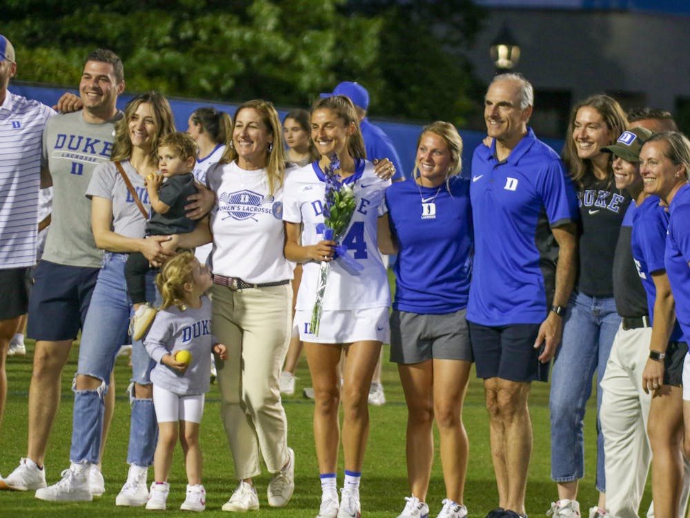 Olivia Navaroli with her family after the game. The midfielder received numerous academic honors through her career and scored her lone goal against Gardner-Webb last season.
