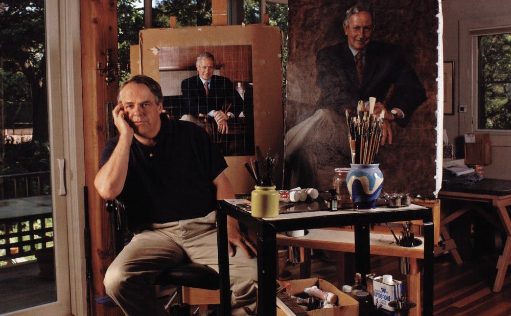 <p>Painter Bob Anderson pictured with his 2006 portrait of President Richard Brodhead.&nbsp;</p>