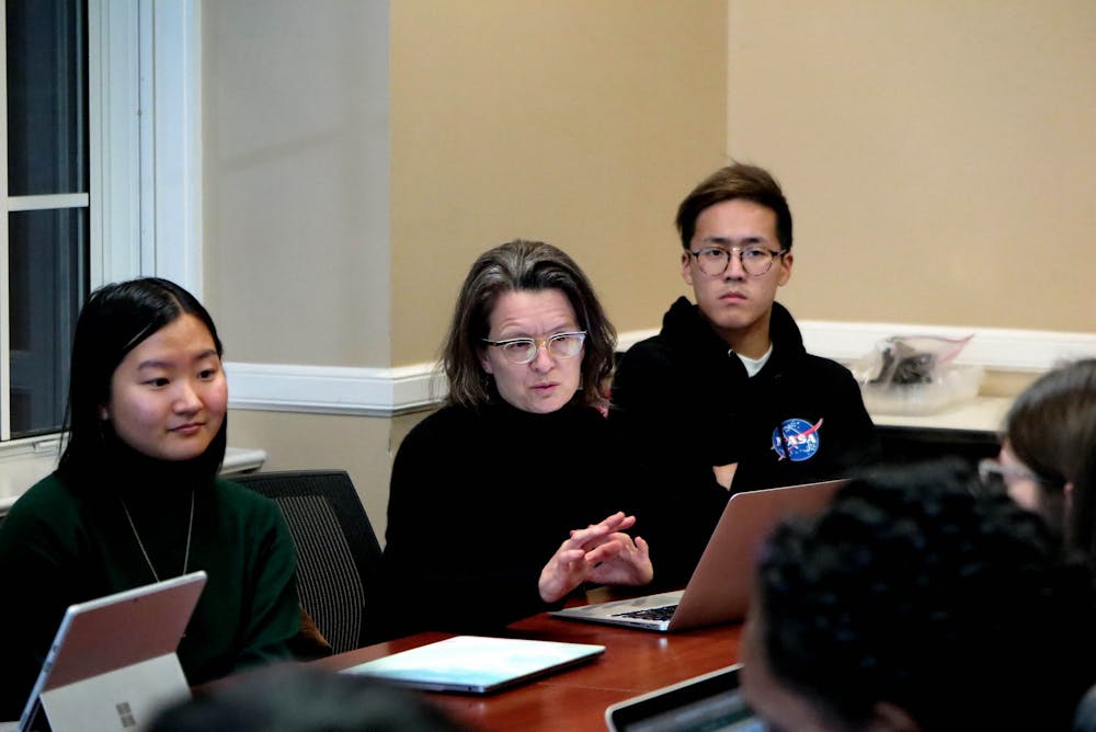 <p>Professor Jocelyn Olcott, center, and her Bass Connections team have worked with researchers around the world to look at the potential for a "global care index" to rate countries on how they value all forms of care.</p>