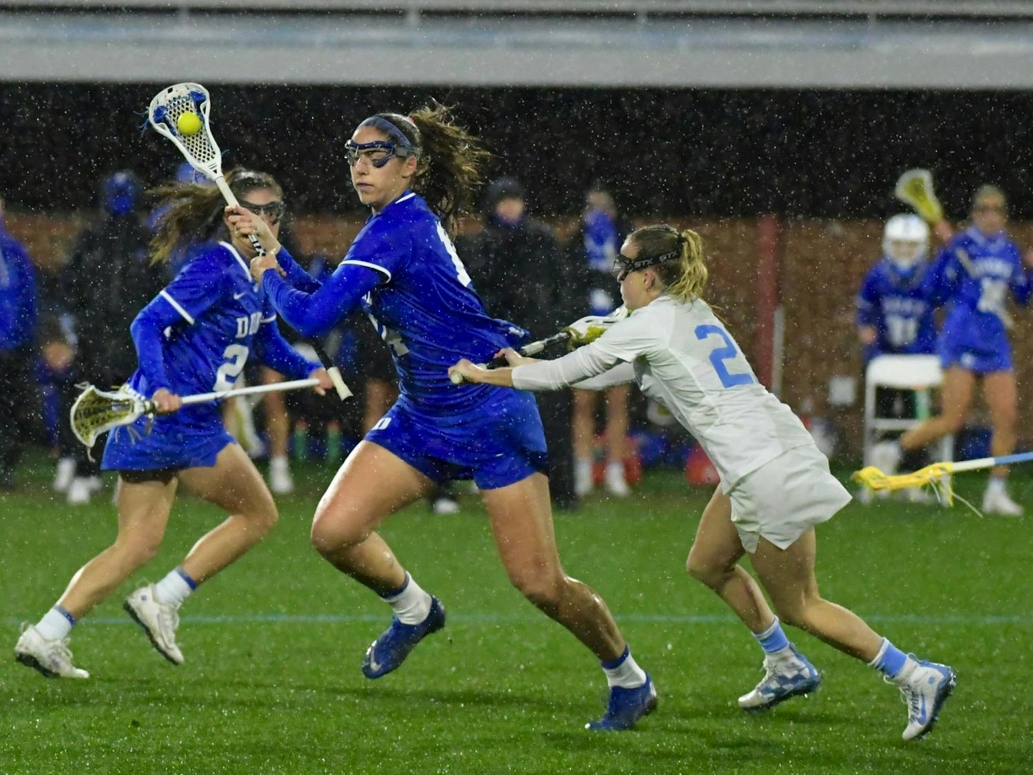 Duke and North Carolina braved heavy rain and bitter cold in their first meeting of the season Friday night.