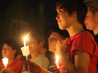 The LGBT community held a candlelight vigil in front of the Duke Chapel Monday night to raise awareness of the Defense of Marriage Act.