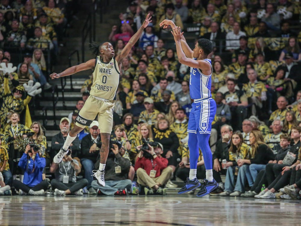 Freshman guard Caleb Foster shoots a 3-pointer in Duke's game against Wake Forest.
