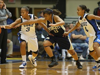 Freshman Chloe Wells (right) split time at point guard with Jasmine Thomas.