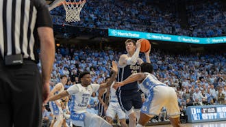 Sophomore center Kyle Filipowski muscles his way to the basket in Duke's loss to North Carolina Feb. 3.