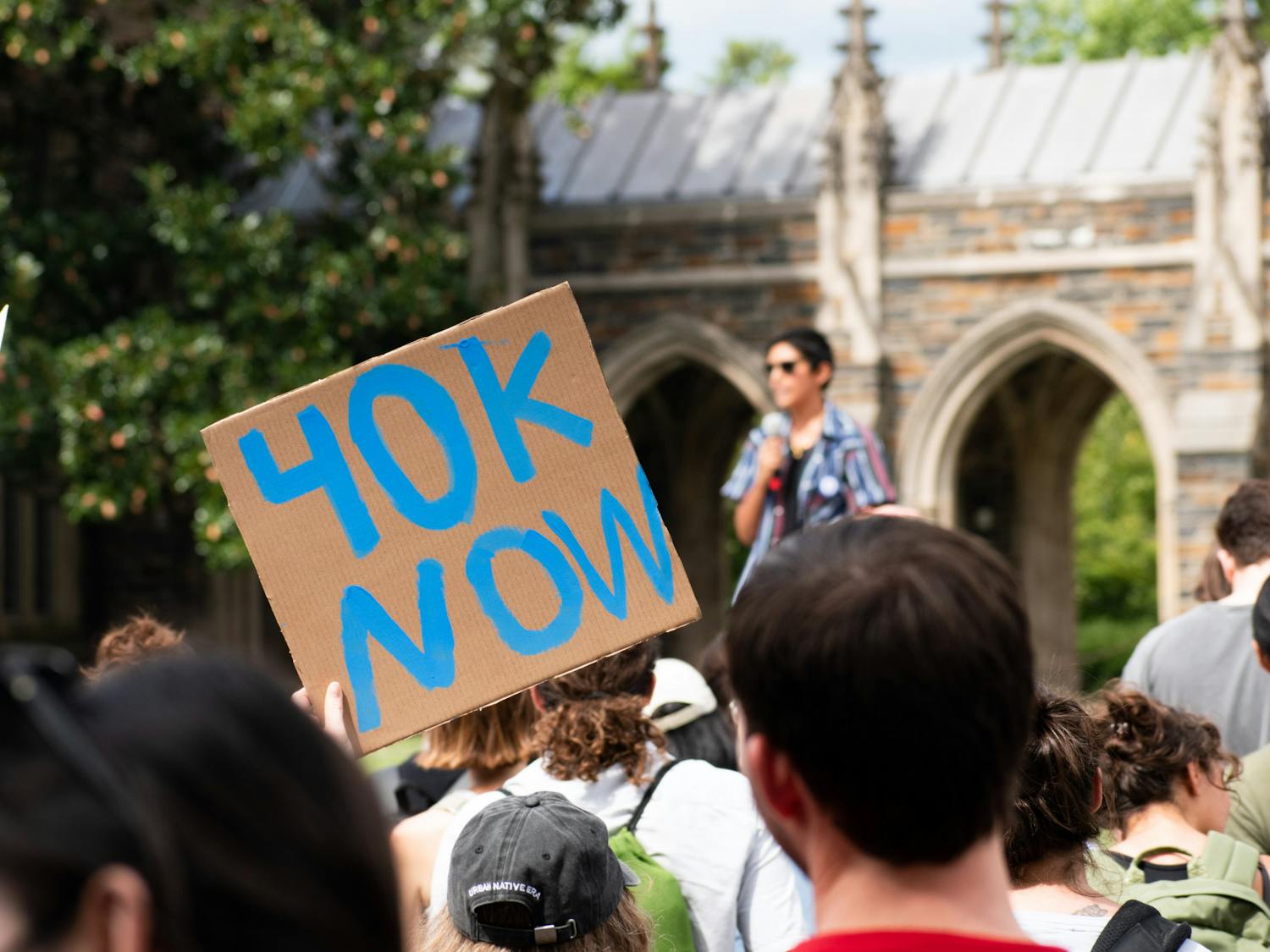 One supporter raises a "40K Now" sign at the Duke Graduate Student Union's rally on Monday, Sept. 5, 2022. The sign refers to DGSU's calls for a $40,000 stipend pay floor.