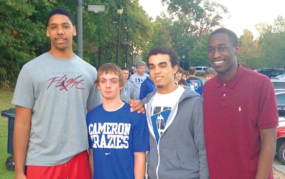 Jahlil Okafor (left) and Tyus Jones (second from right) are college basketball's most coveted recruiting package.