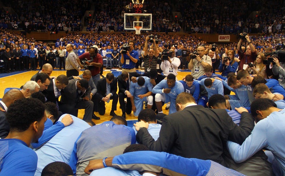 A memorable tribute occurred before the 239th installment of Duke-UNC with players and coaches on both sides coming together at mid-court.