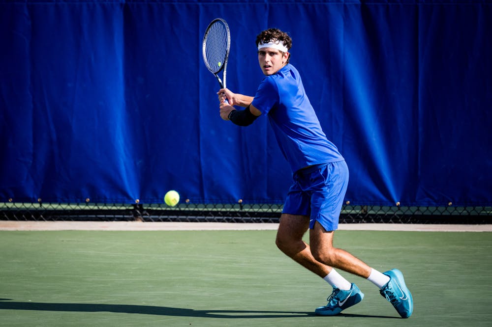 <p>Sophomore Pedro Rodenas returns a backhand against Alabama.&nbsp;</p>