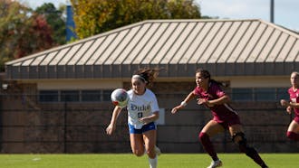 Katie Groff races after the ball while being pursued by a Florida State defender.