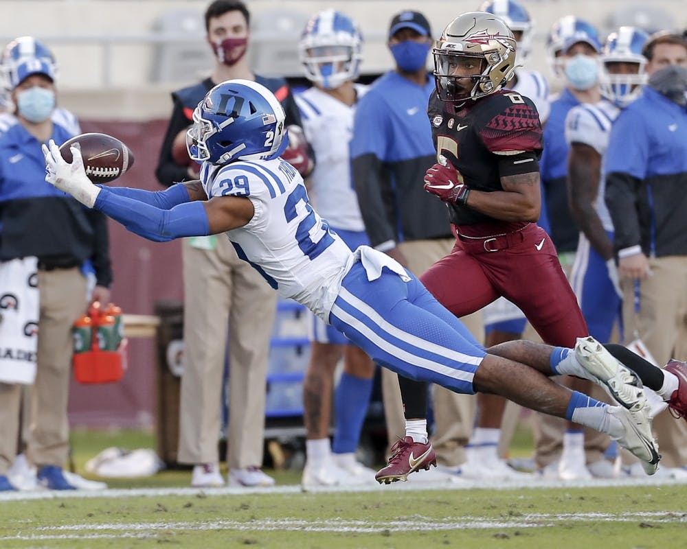 Despite two turnovers, including this diving interception, forced by safety Nate Thompson, Duke was unable to stop Florida State's offense from putting points on the board.