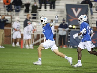 Joe Robertson (left) and Nakeie Montgomery (right) are set to return for one last season with Duke men's lacrosse next spring.