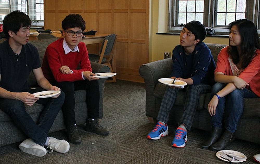 Students share lunch with two college-age North Korean refugees as they tell the story of their escape earlier this week