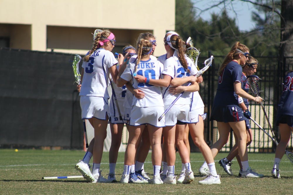 The Blue Devils used a balance offensive attack and strong play between the pipes from Kelsey Duryea to hold off No. 16 Virginia Saturday afternoon.