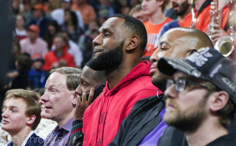 <p>LeBron James sat courtside at John Paul Jones Arena Saturday night along with Lakers teammate Rajon Rondo.</p>