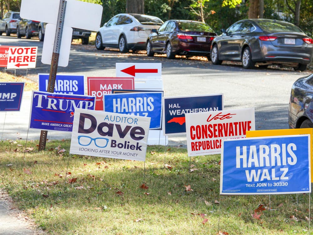 Campaign signs at the George Watts Elementary School polling site.