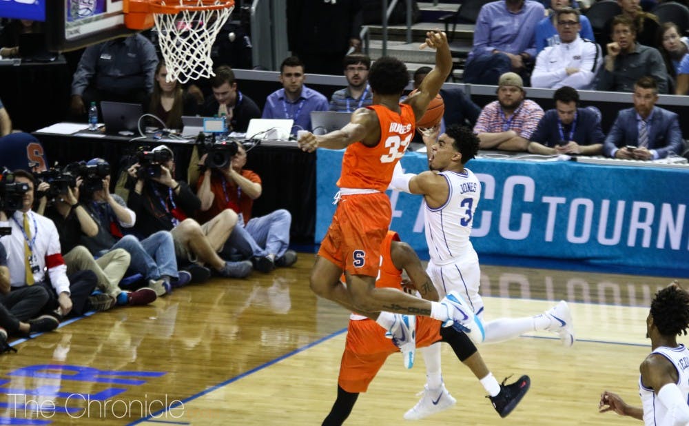 <p>Tre Jones takes it to the basket against Syracuse.</p>