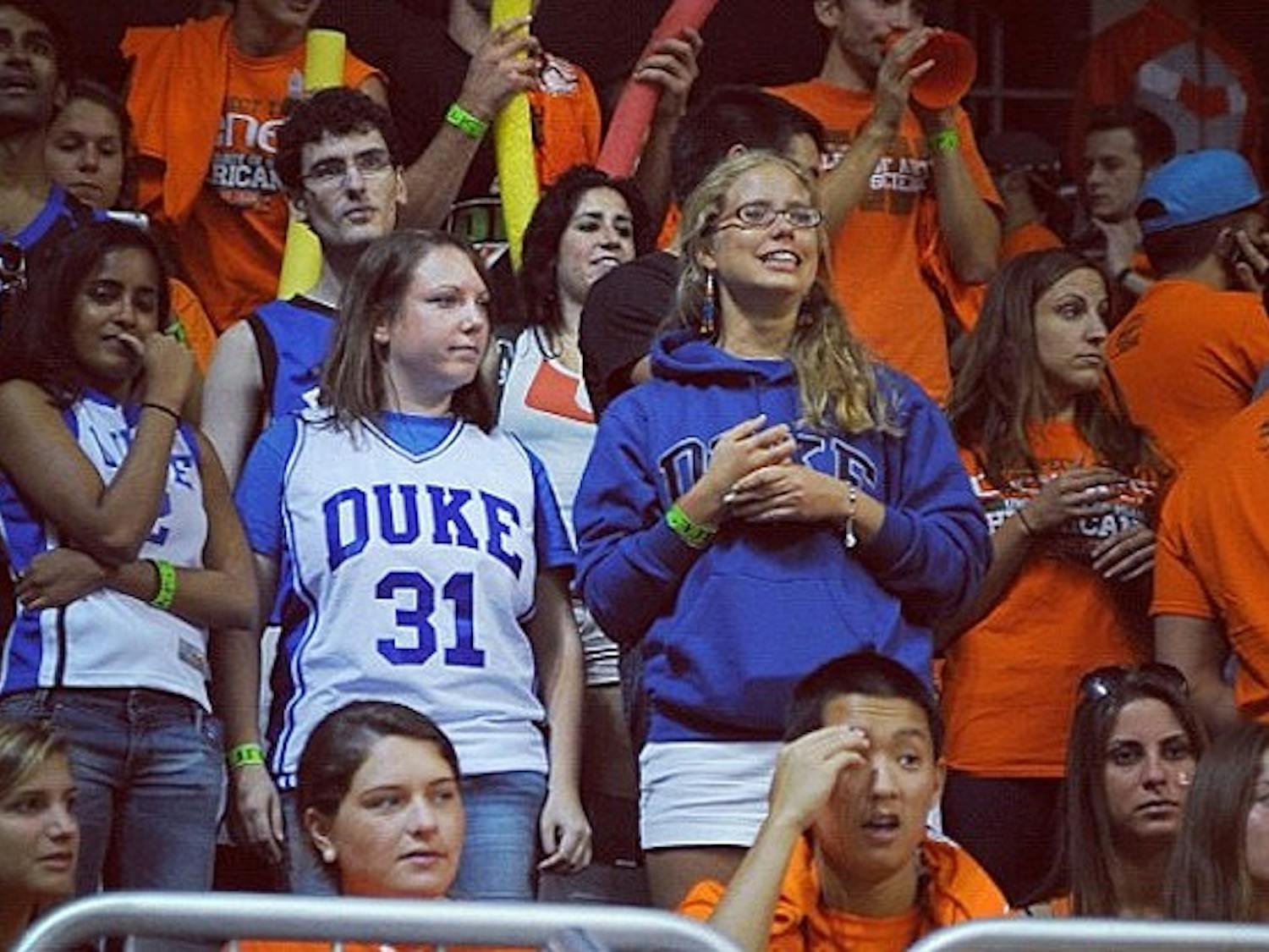 A photo from DukeBluePlanet of Michelle Picon and her friends at the Miami game captioned "Found brave Duke fans in the Miami student section."