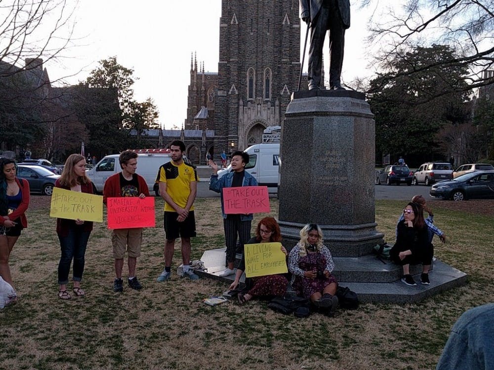 Students and Duke community members protested alleged mistreatment of parking employees Tuesday.