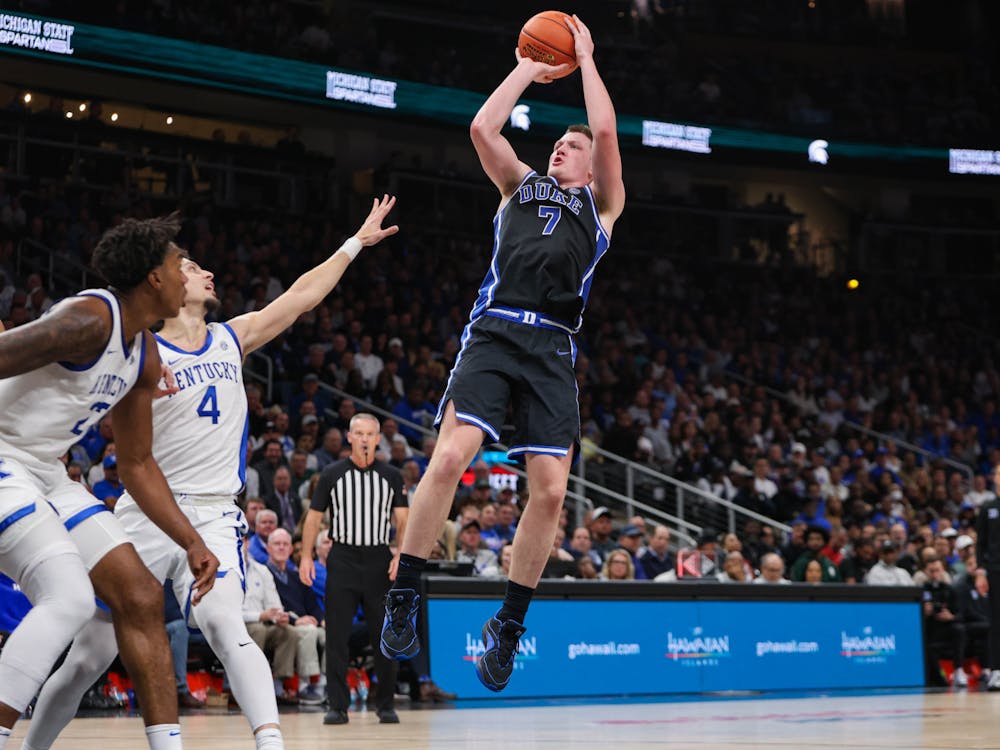 Freshman Kon Knueppel attempts a jump shot against Kentucky.