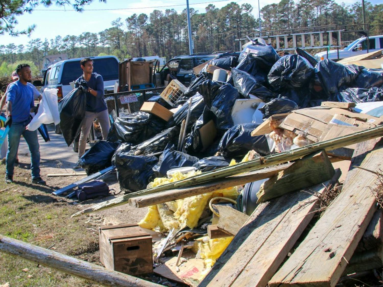 Duke undergraduates and graduate students came together to bring supplies and help clean houses damaged from Hurricane Florence in Carteret County, where the Marine Lab is located.