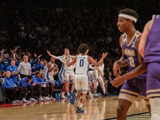 Freshman guard Jared McCain shrugs to the bench after nailing a triple in Duke's second-round victory against James Madison.