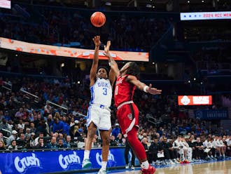 Jeremy Roach goes for a jumper in Duke's ACC Tournament matchup against the Wolfpack.