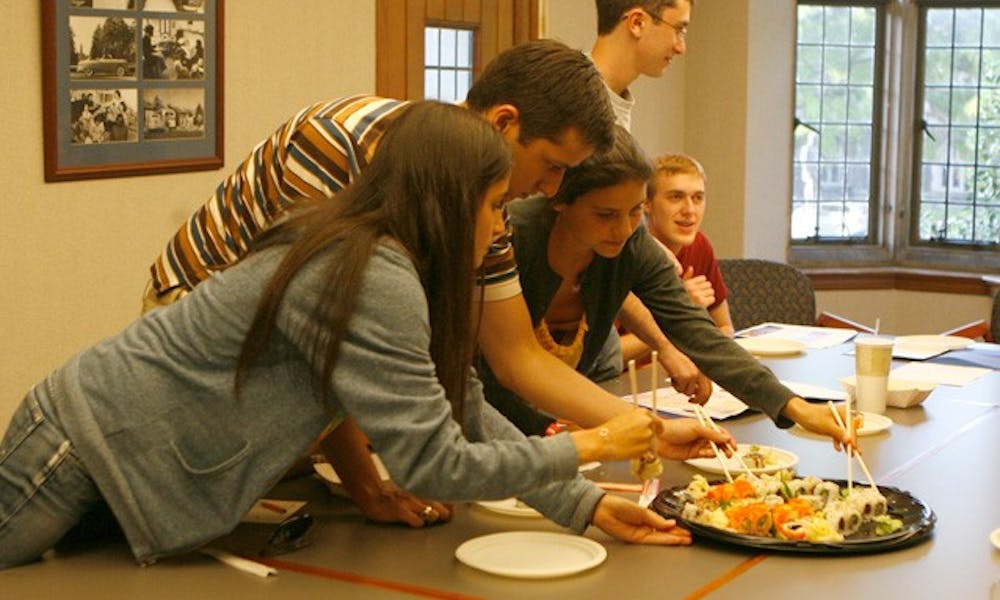 DUSDAC members sample sushi from Chef’s Deal, a proposed eatery with an Asian fusion menu, at their meeting Monday. Members also heard a presentation from Armadillo Grill at the meeting.