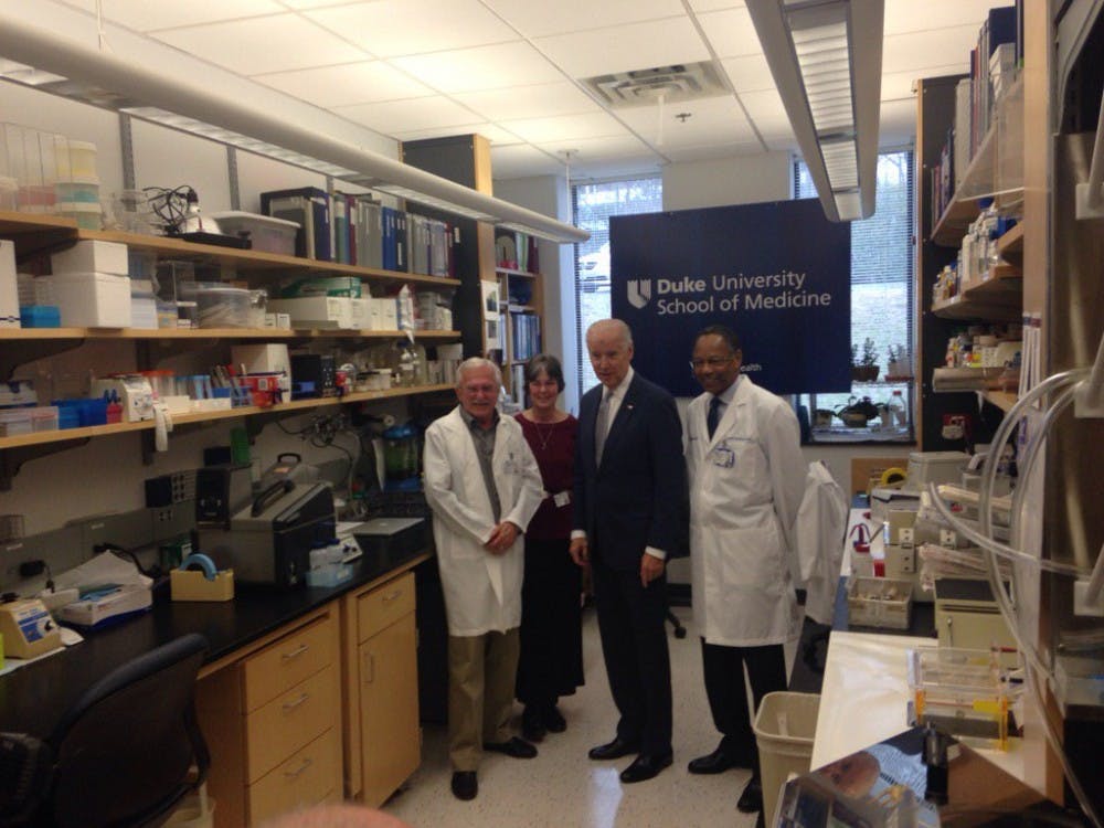 Vice President Joe Biden tours the lab of Nobel laureate Paul Modrich