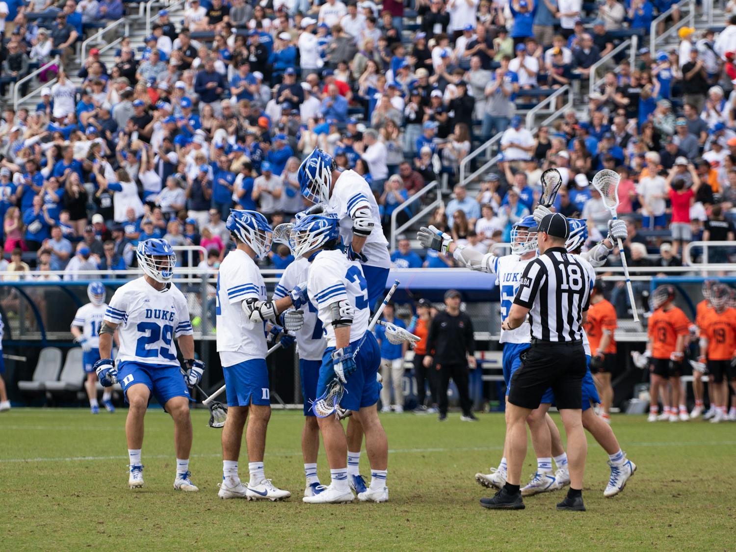 The Blue Devils celebrate one of their many goals during Sunday's demolition of Princeton.