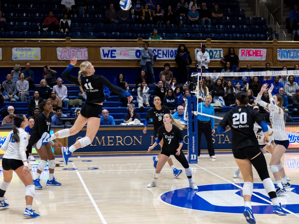 Kerry Keefe leaps for a spike against Cal. 