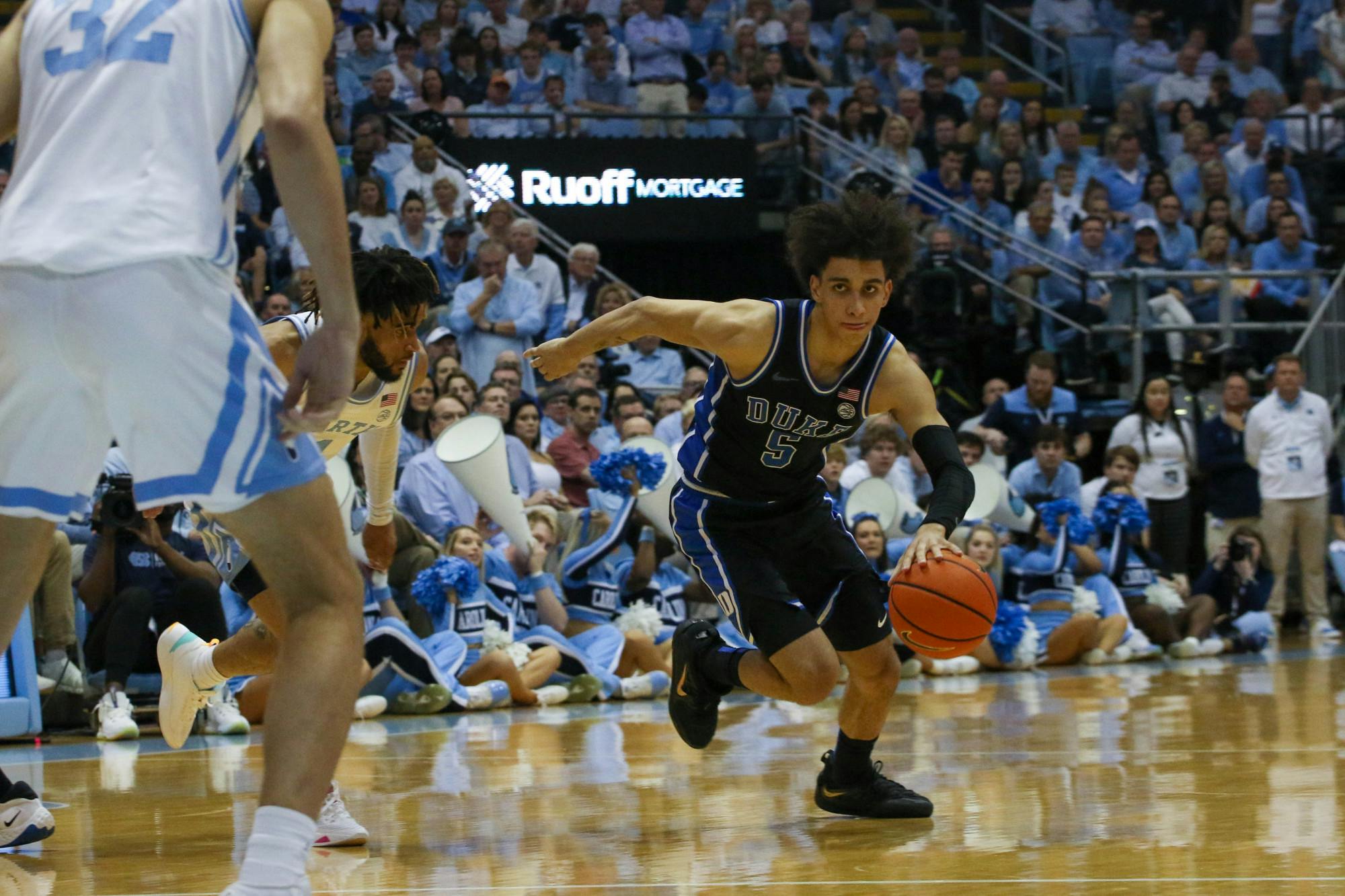 Tyrese Proctor surges forward with the ball against North Carolina.