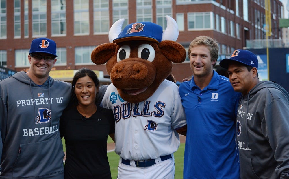 The Durham Bulls honored Duke’s two national championship teams Monday as Celine Boutier and Will Haus threw out the first pitch in front of an excited Durham crowd.