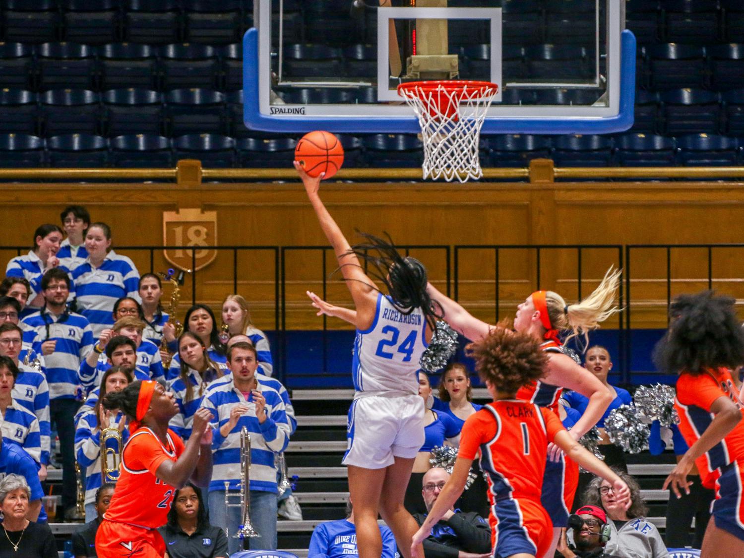 Reigan Richardson lifts the ball above Virginia defenders during Duke's Thursday win.