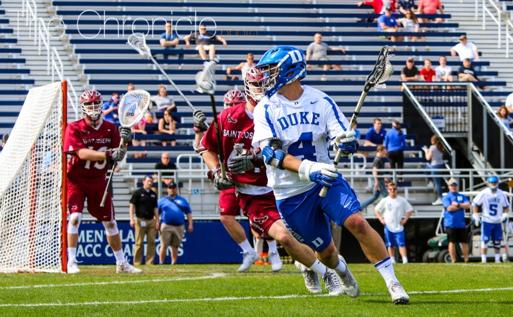 <p>Junior Mitch Russell had a pair of goals Saturday as the Blue Devils opened up a 12-2 first-half lead.&nbsp;</p>