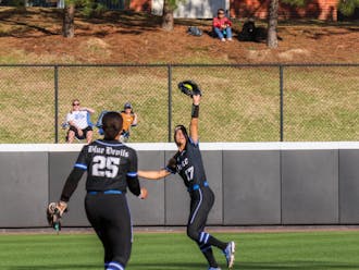 Sophomore Aminah Vega battles the sun to catch a fly ball in Duke's game against North Carolina.