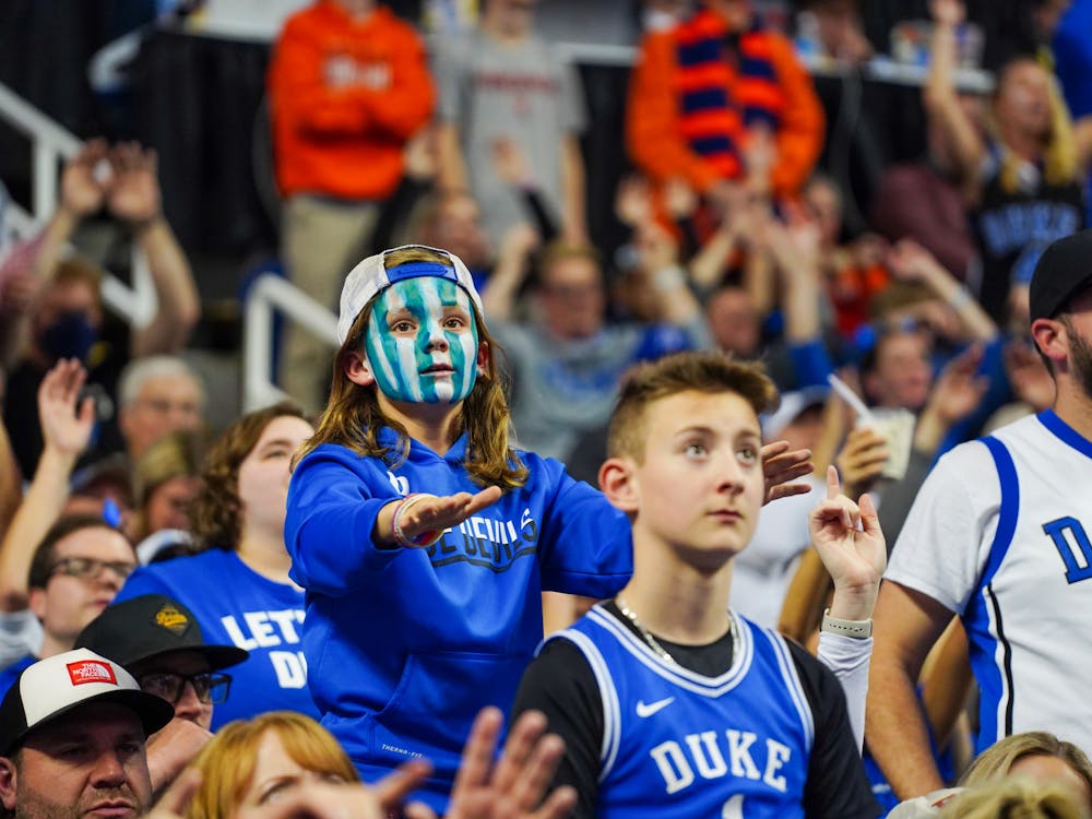 A young fan anticipates Blue Devil free throws during the ACC championship game.