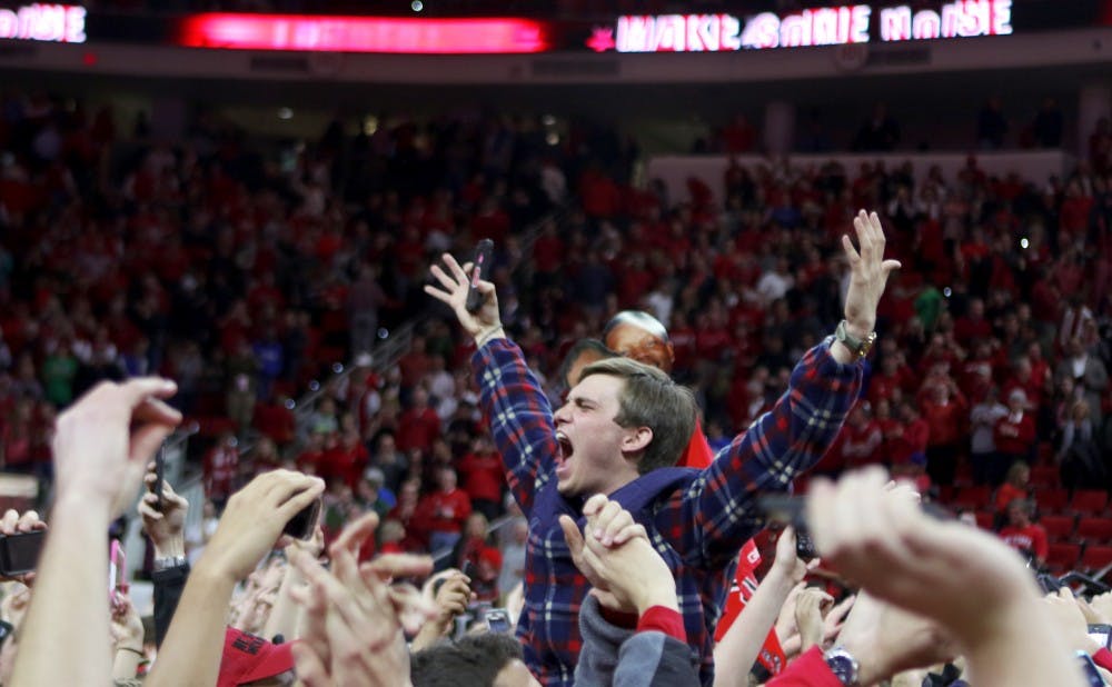 Fans stormed the court after the Wolfpack knocked off the Blue Devils in Raleigh for the second time in three years.