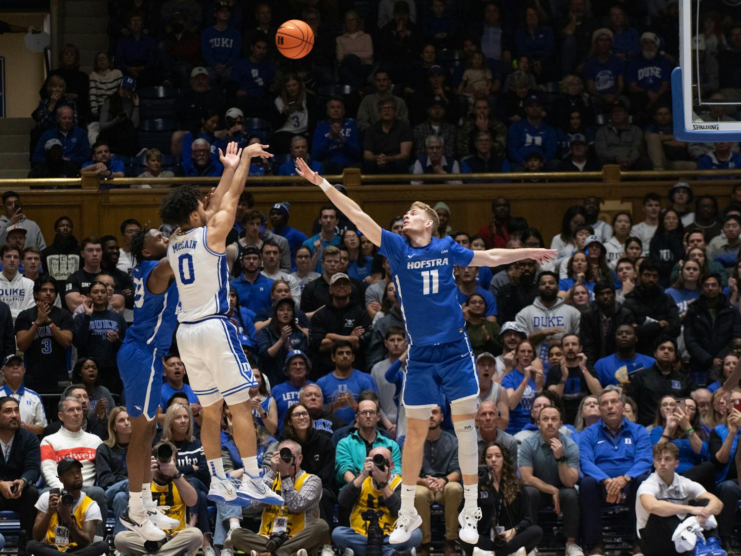 Jared McCain shoots over a defender during Duke's Dec. 12 win against Hofstra.