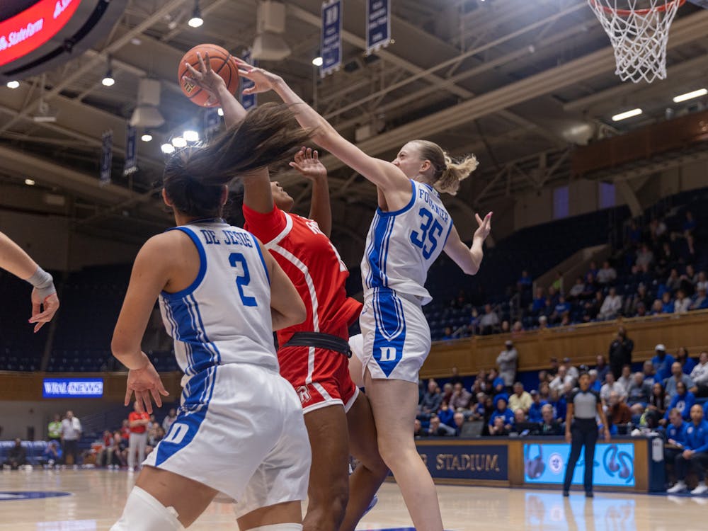 Freshman Toby Fournier skies for a block against Radford. 