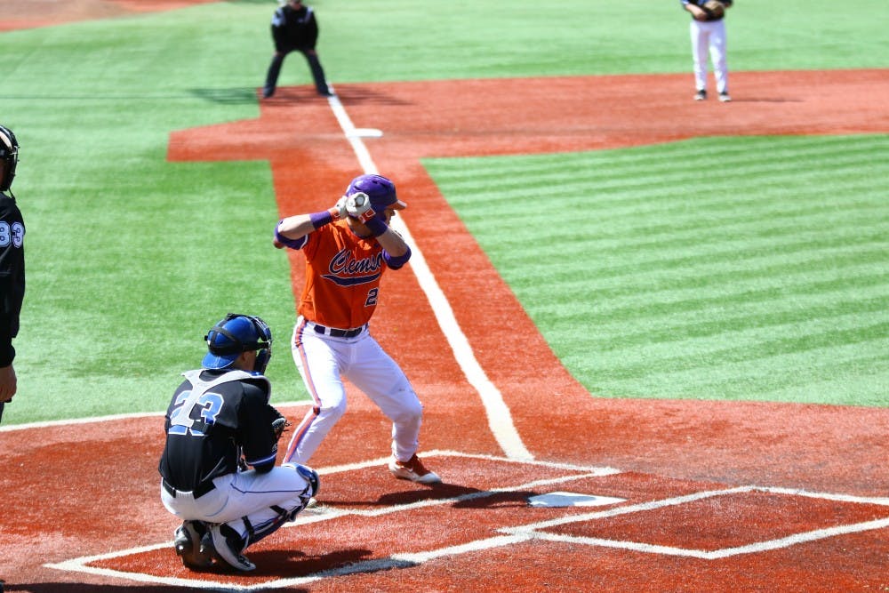 Clemson catcher Chris Okey's fly ball&nbsp;in the right-center gap fell just past the outstretched Evan Dougherty, allowing the go-ahead run to score with two outs in the ninth inning.