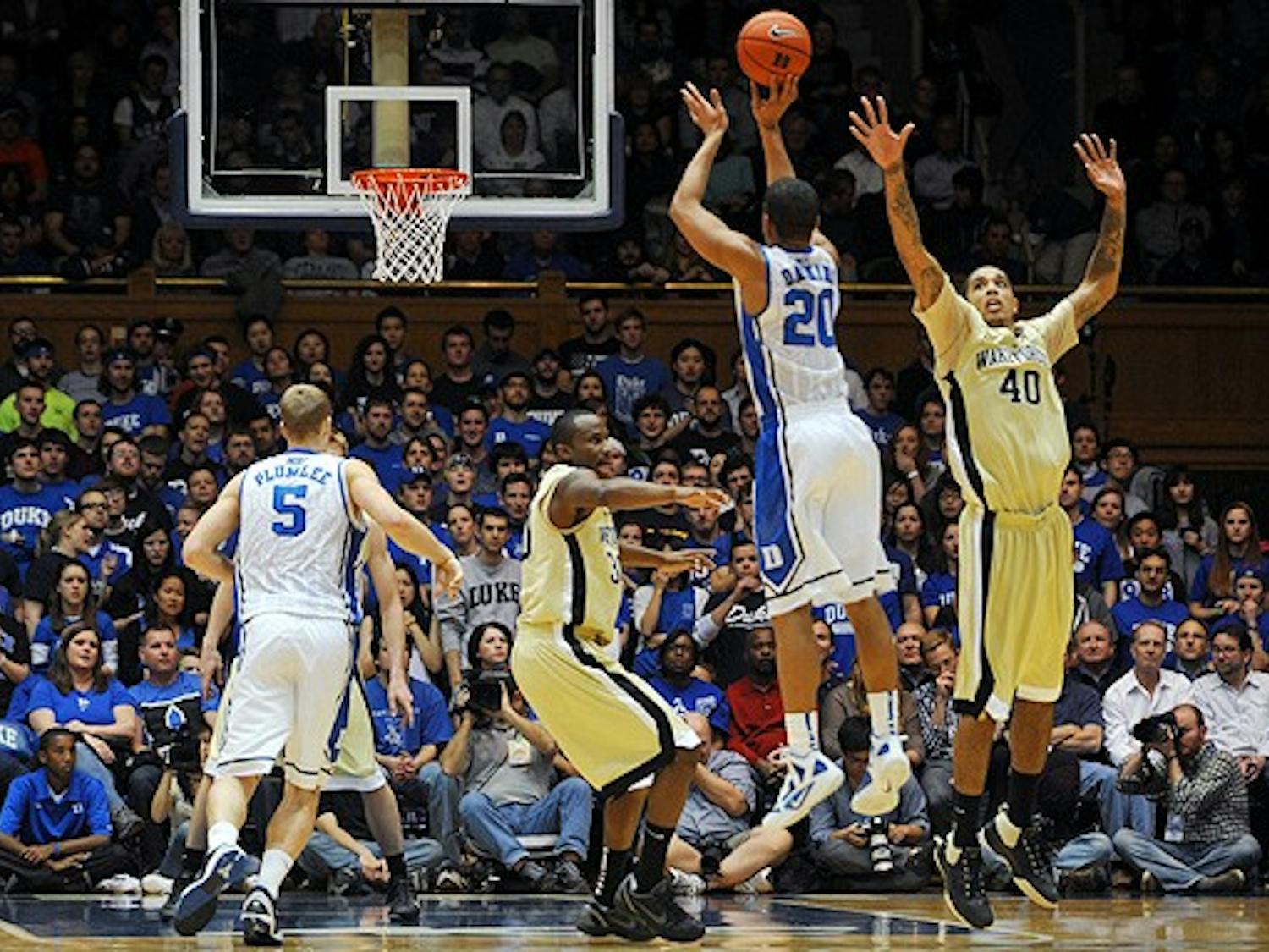 Junior Andre Dawkins hit seven 3-pointers in the first half as Duke downed ACC rival Wake Forest, 91-73.