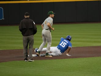 Kyle Johnson slides onto the base during Duke's loss to William and Mary.